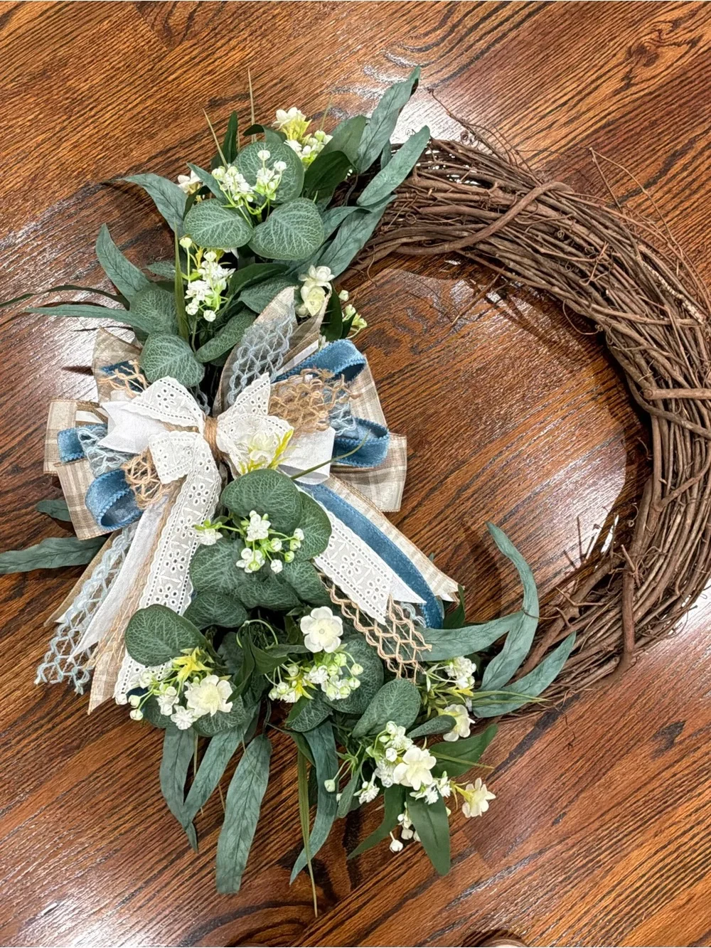 Spring Eucalyptus and White Flower Grapevine Wreath with Blue Accents